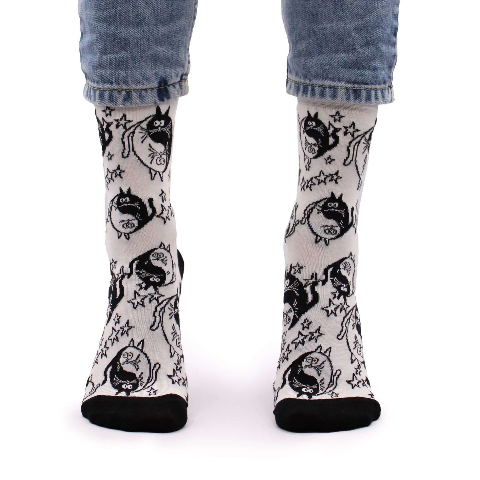 Hop Hare Bamboo Socks S/M - Ying Yang worn by a model, showcasing a fun black and white design.