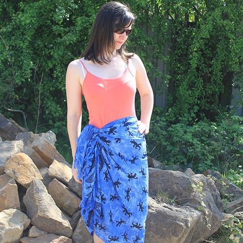 Bali Gecko Sarongs - Blue features a playful gecko pattern on a stunning blue base, perfect for bohemian style.