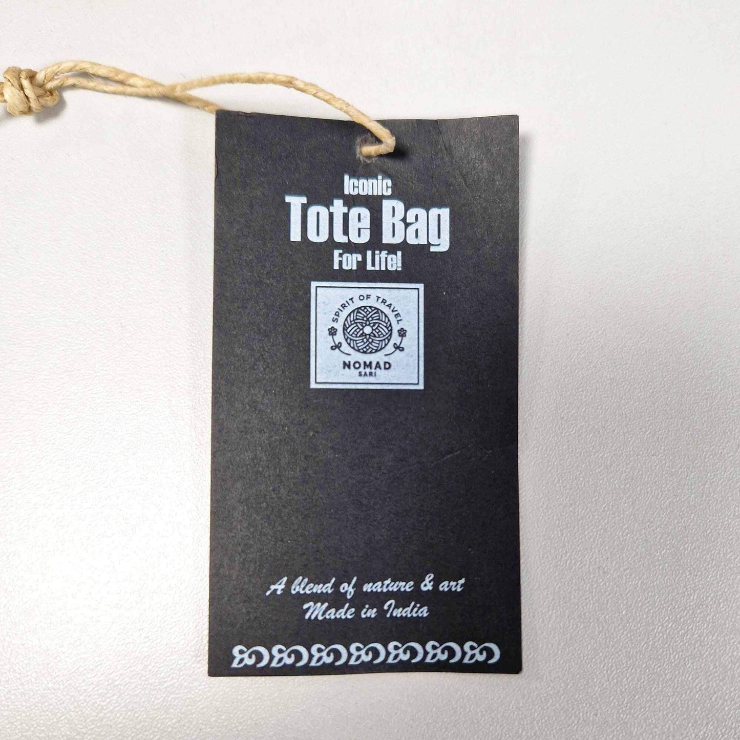 Iconic Classic Tote Bag - It's a Dogs Life - White 10oz tag showing details of the product.