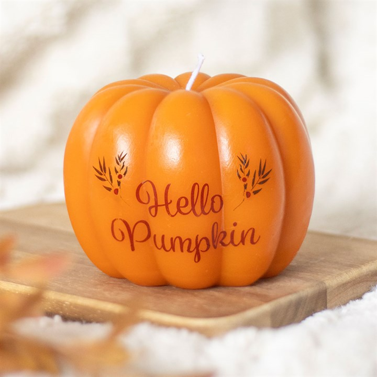 Hello Pumpkin shaped candle featuring pumpkin motif and Hello Pumpkin inscription, unscented for autumn decor.