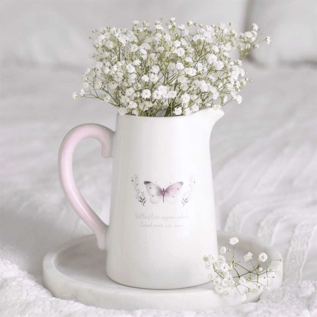 White Butterfly Print Ceramic Flower Jug With Heartfelt Message filled with delicate flowers on a marble tray