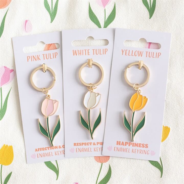 Pink Tulip Keyring, white and yellow tulip enamel keyrings displayed on floral background.
