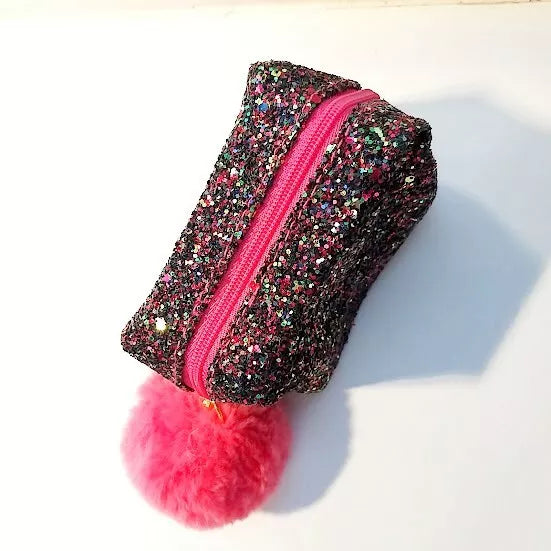 Sparkle Mini Cosmetics Bag, Pink, Avon with multicoloured glitter and pink pompom zipper pull, perfect for travel or daily use.