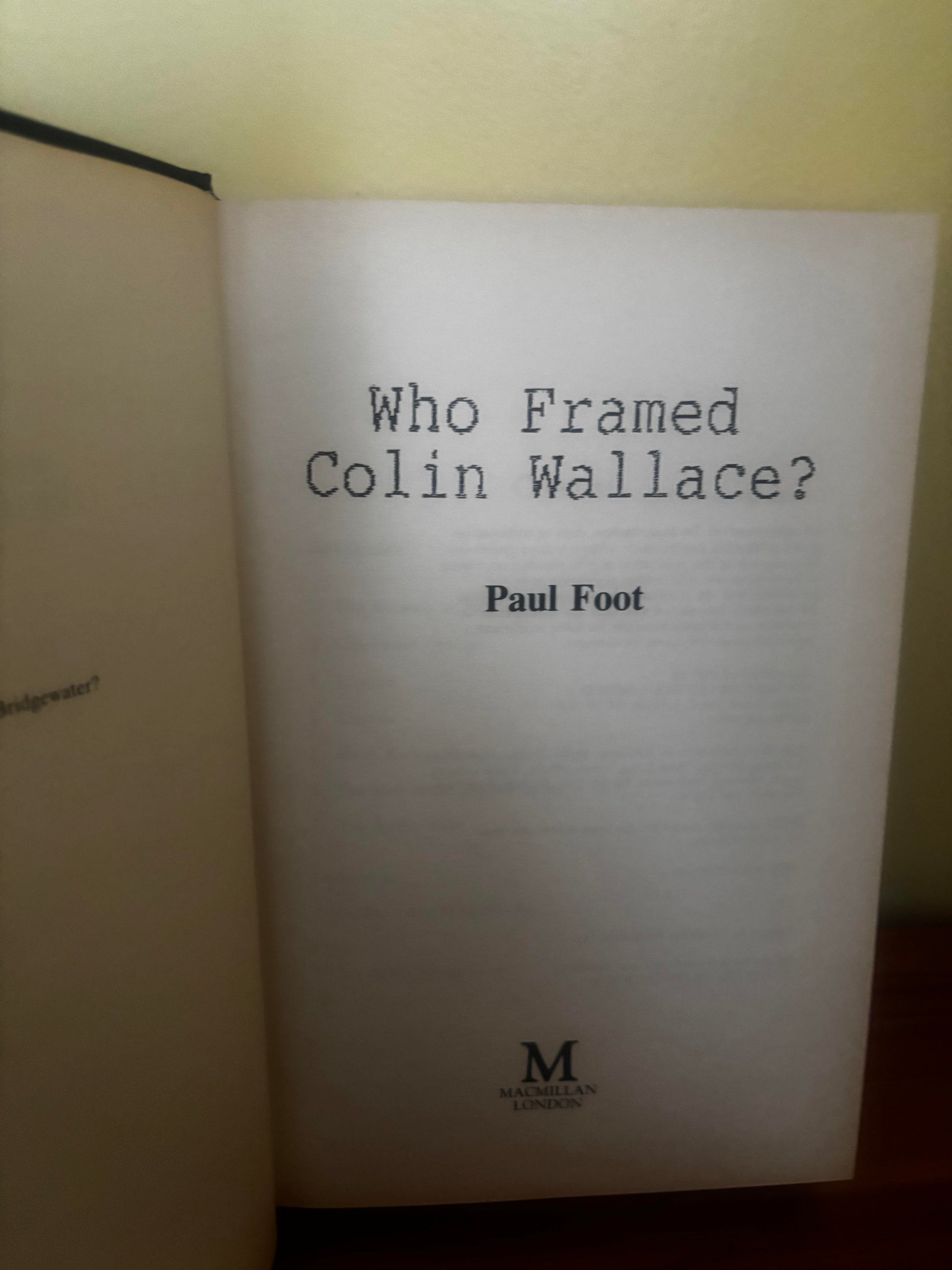 Book titled 'Who Framed Colin Wallace?' by Paul Foot on a plain background