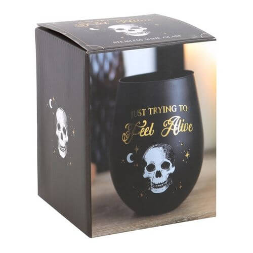 Distinctive Trying to Feel Alive Stemless Wine Glass featuring a playful skeleton design in black and gold elegance.