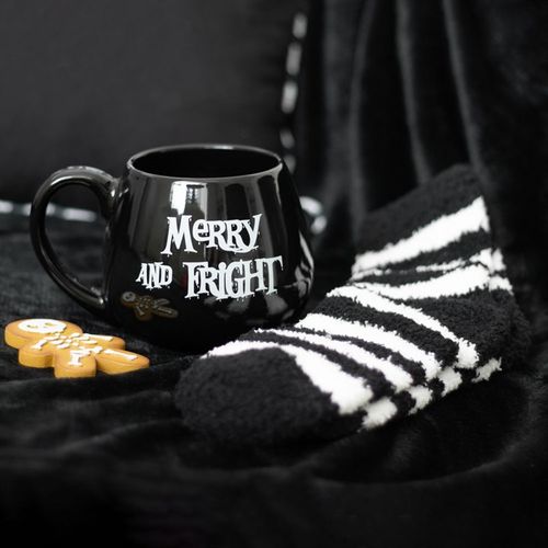 Cosy up with the Merry and Fright Mug and Socks Set, featuring a spooky mug and fluffy striped socks for winter nights.